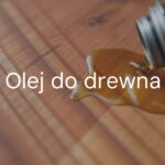 Wooden board being oiled, natural wood grain enhanced, rich deep color, matte finish, protective coating, realistic close-up, warm lighting.